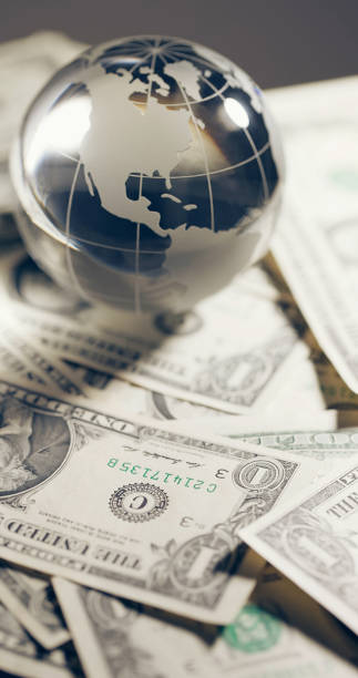 istock Glass globe and money 2109062416