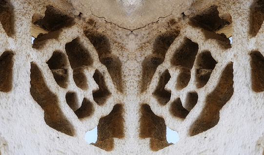 Symmetrical Pattern Of Ornate Stone Carving In Sandy Tones