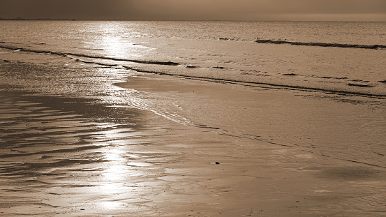 Sepia Toned Serene Beach Seascape With Gentle Waves