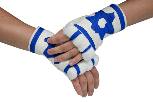 Hands of wearing boxing gloves with Israel flag, Hand of Israel flag, isolated on white background.