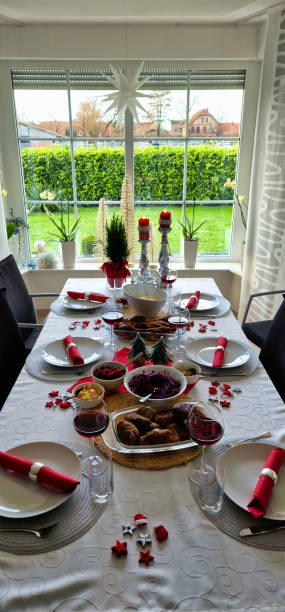 istock Table adorned with plates, bowls, and candles, creating a cozy dining atmosphere 2109136470