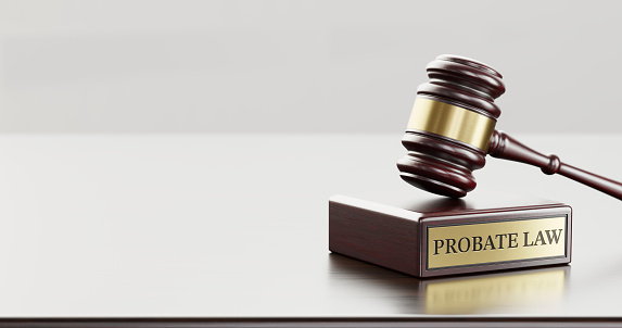 Probate law: Judge's Gavel as a symbol of legal system and wooden stand with text word.