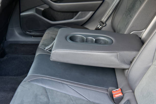 istock Armrest in the luxury passenger car with cup holder between the front seats 2109191504