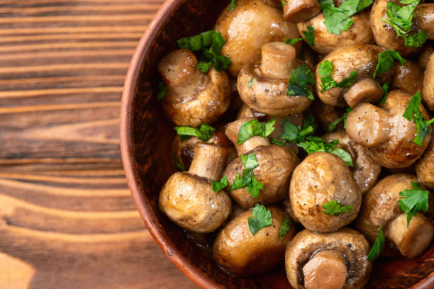 istock Fried mushroom champignon with onion and parsley 2109194671