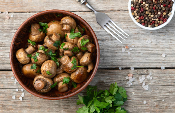 istock Fried mushroom champignon with onion and parsley 2109194681