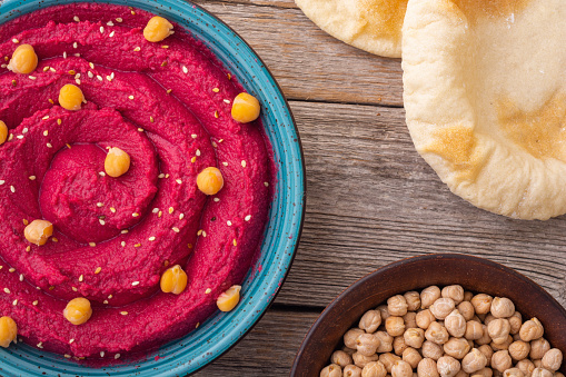 Declicious food from chickpea - beetroot hummus . Israel and arabic kitchen
