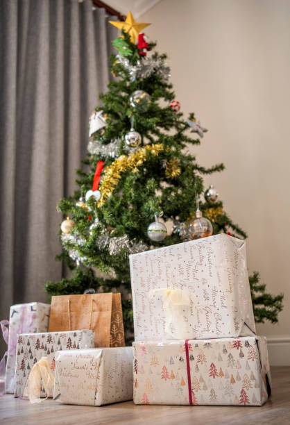 istock Christmas tree and gifts at home during the holidays 2109195231