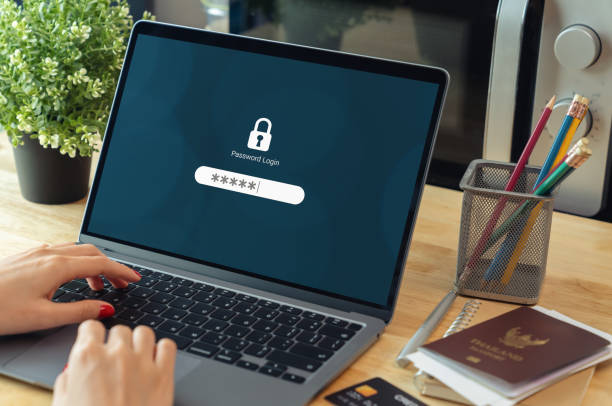 istock Woman hand typing password security login in laptop computer. 2109210881