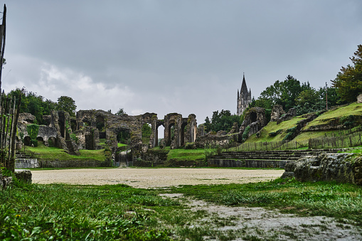 Saintes, France - 09 26 2021: The roman Gallo Amphitheatre of Mediolanum Santonum in the city center of Saintes, an ancient ruin in France.