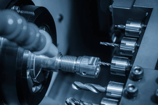 istock The  multi tasking CNC lathe machine swiss type tapping the brass fitting parts. 2109277841
