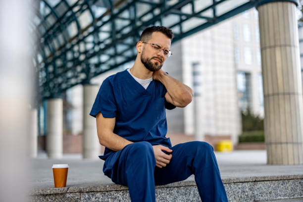 istock Male nurse having neck pain 2109277850