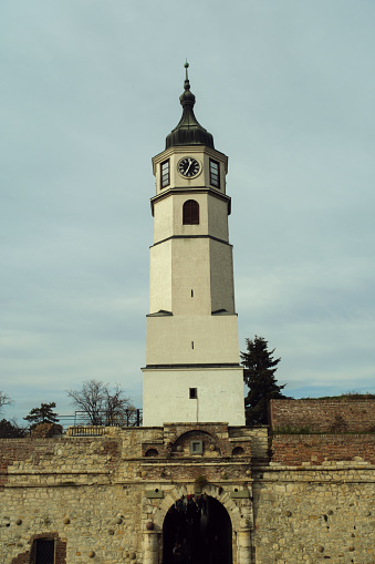 Belgrade, Serbia - View of the historic clock tower in Kalemegdan Park against a cloudy sky.