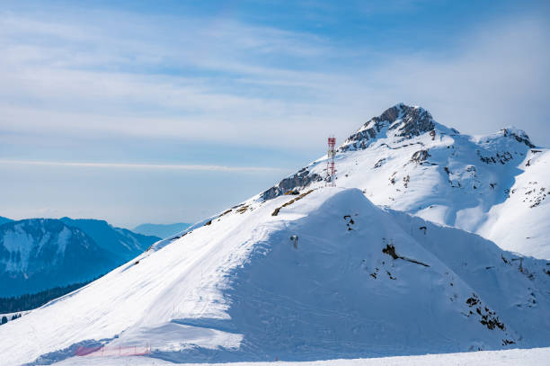 istock peaks of snow-capped mountains in winter 2109299027