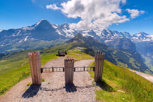 Hiking trail to summit of mountain Mannlichen with popular viewpoint in Swiss Alps, Switzerland.