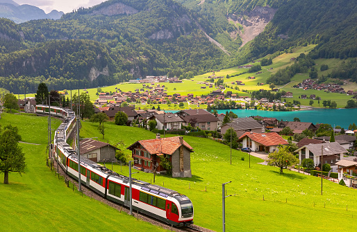 Famous electric red tourist panoramic train in swiss village Lungern, Obwalden, Switzerland