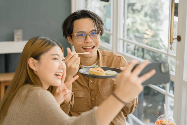 istock Couple Enjoying Drinks at a Cozy Cafe. 2109324688