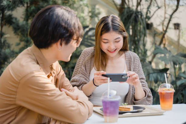 istock Couple Enjoying Drinks at a Cozy Cafe. 2109325058