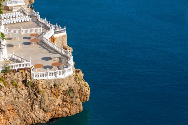 istock Observation platform to the classic decorative stone railings and tables restaurant on the rock. 2109345831