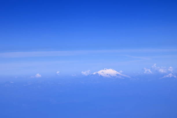 Cloudy weather, snow-capped mountains on the plateau