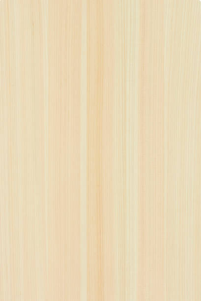 High angle view of a flat textured wooden board backgrounds. It has a beautiful nature and abstractive pattern. A close-up studio shooting shows details and lots of wood grain on the wood table. The piece of wood at the surface of the table also appears rich wooden material on it. The wood is dark brown color with darker brown lines and pattern on the bottom. Flat lay style. Its high-resolution textured quality.