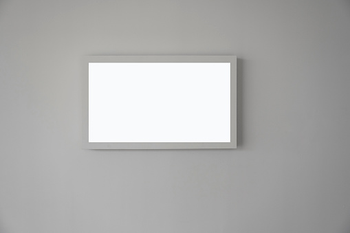 A blank picture frame on the wall