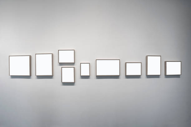 istock Blank picture frames on indoor walls 2109467812