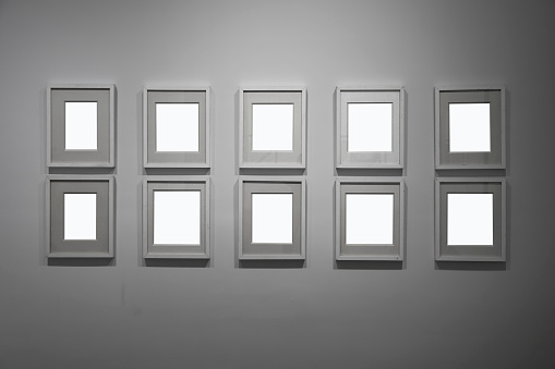 Multiple blank frames on indoor walls