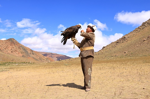 August 27 2023 - Bokonbayevo, Issyk Kul Province in Kyrgyzstan: a Kyrgyz Eagle Hunter with His Eagle