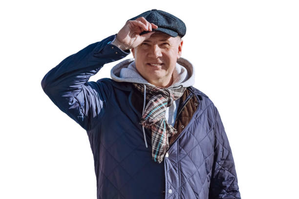 Happy smiling man in blue down jacket greeting with hand at the head