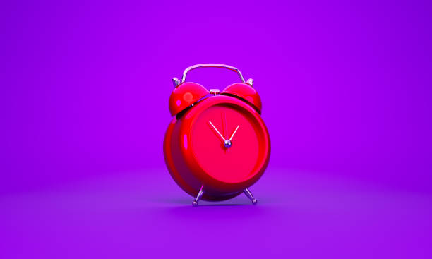 istock Red Alarm Clock On Purple Background 2109479378