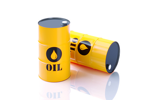 Yellow oil barrels on white background. Horizontal composition. Clipping path is included.