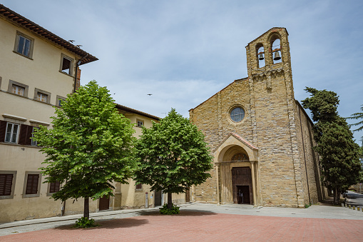 Walking Arezzo city streets. View of The Basilica of San Domenico central facade.