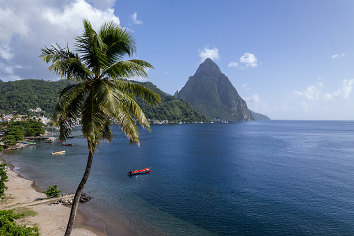 Aerial  of Gros Piton and Petit Piton on St. Lucia from Soufriere Beach.  Shot on a DJI Drone Air 2s in the Caribbean on beautiful Saint Lucia island.