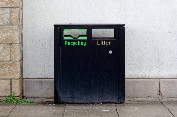 istock Black litter bin with recycling compartment for rubbish collection 2109517990