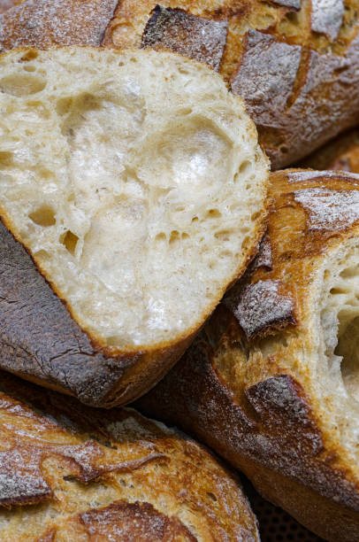 istock Large loaves of freshly baked wheat bread 2109645219