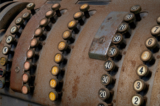 close up of cash register keys on an antique cash register, for sale at a junkyard, Long Island, New York
