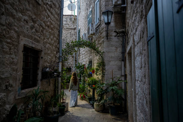 Woman explores old town streets and corridors