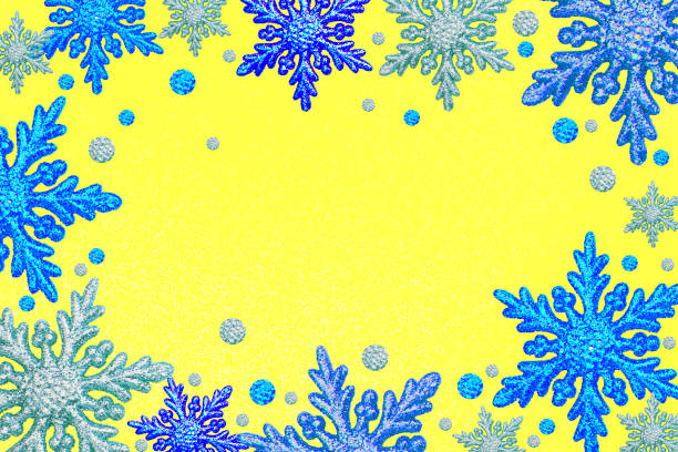 Christmas frame silver blue snowflakes Yellow background Border sequin confetti Glitter powder sparkling Frosting winter Xmas holiday season Dots Snow Flake Decoration New Year glitter Toy Copy space