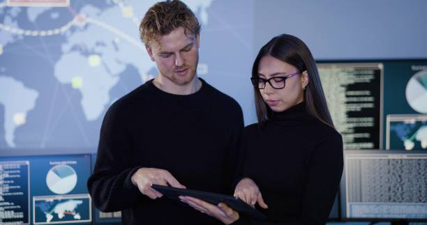 istock Focused professional cyber security team working to prevent security threats, find vulnerability and solve incidents 2109844824