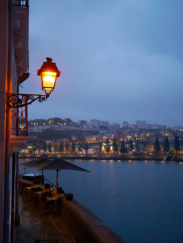 Old town Porto, Portugal in twilight, looking over Douro river to Gaia view, the famous medieval unesco travel destination. Oporto