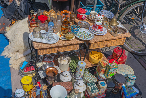 Amsterdam, Netherlands - May 16, 2018: Crockery Knick Knack Vintage Boxes for Sale at Flea Market in Old Town.