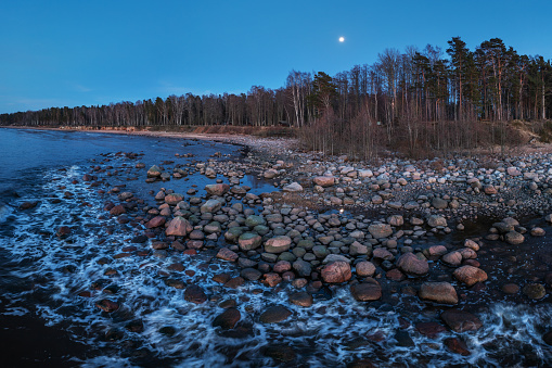 The rocky beach of Vidzeme after sunset. Photographed with a drone