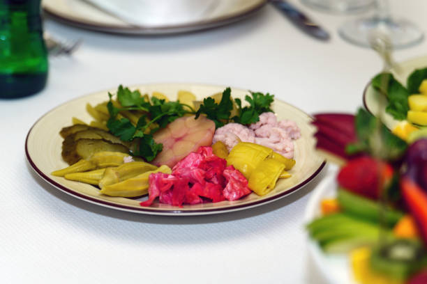 Pickled vegetables, garlic, peppers, cabbage on a plate