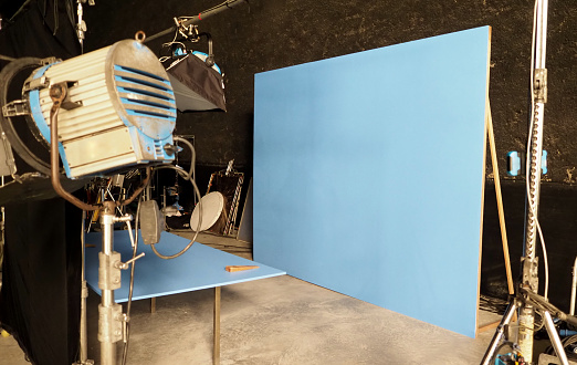 Blue screen backdrop and big LED studio light for movie video or film photography production and other equipment such as tripod, black screen backdrop, prop and any professional tools.