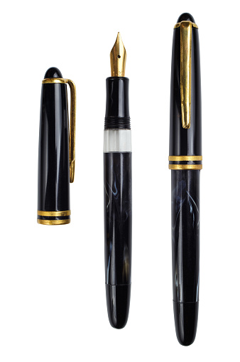 Vintage gold plated fountain pen isolated on a white background with clipping path