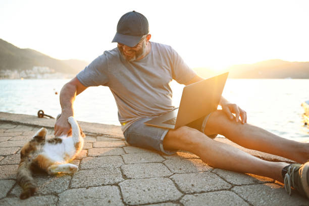 istock Mature adult man traveler ( with laptop) 2110054894