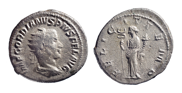 Ancient Roman coin isolated on white.