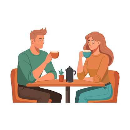 Man And Woman Sitting At The Table And Drinking Coffee