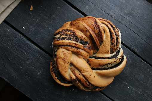 Homemade sweet roll with poppy seeds.