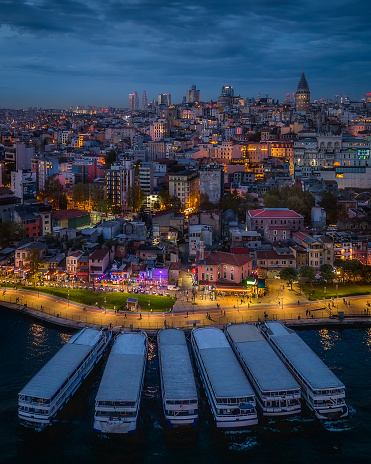 The enchanting city of Istanbul comes to life in this captivating photograph featuring the iconic Galata Tower. The image showcases the timeless allure of Istanbul, where ancient history meets modern vibrancy. As traditional boats gracefully navigate the waters, framed by  the historic tower, one can't help but be drawn into the magic of this dynamic cityscape. Whether it's the rich cultural heritage, stunning architecture, or vibrant atmosphere, Istanbul never fails to leave a lasting impression on all who visit.